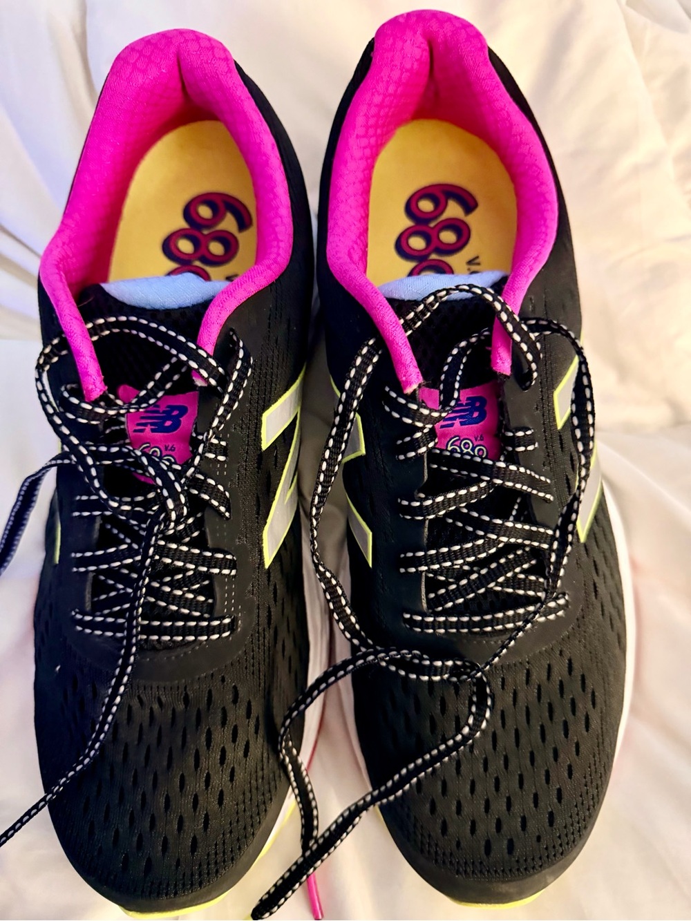 New Balance Women's Black Running Shoes with Pink Lining and Yellow Accents
